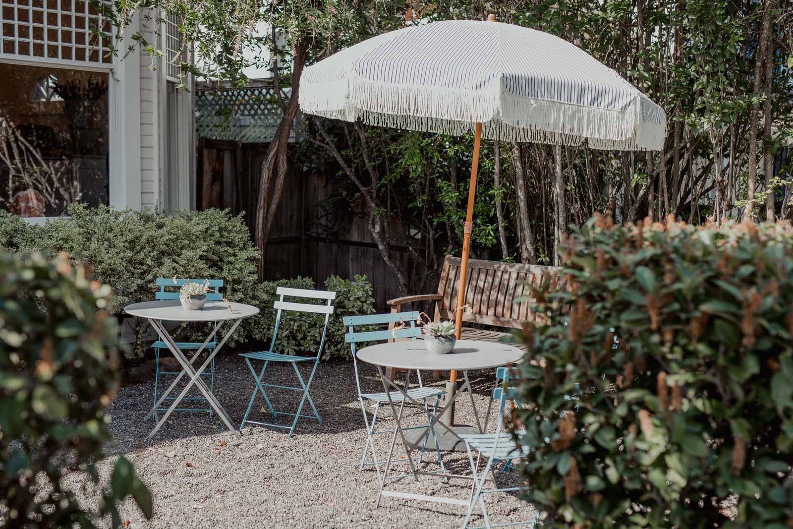 an inn to remember inn patio with a table and an umbrella in the center to the patio