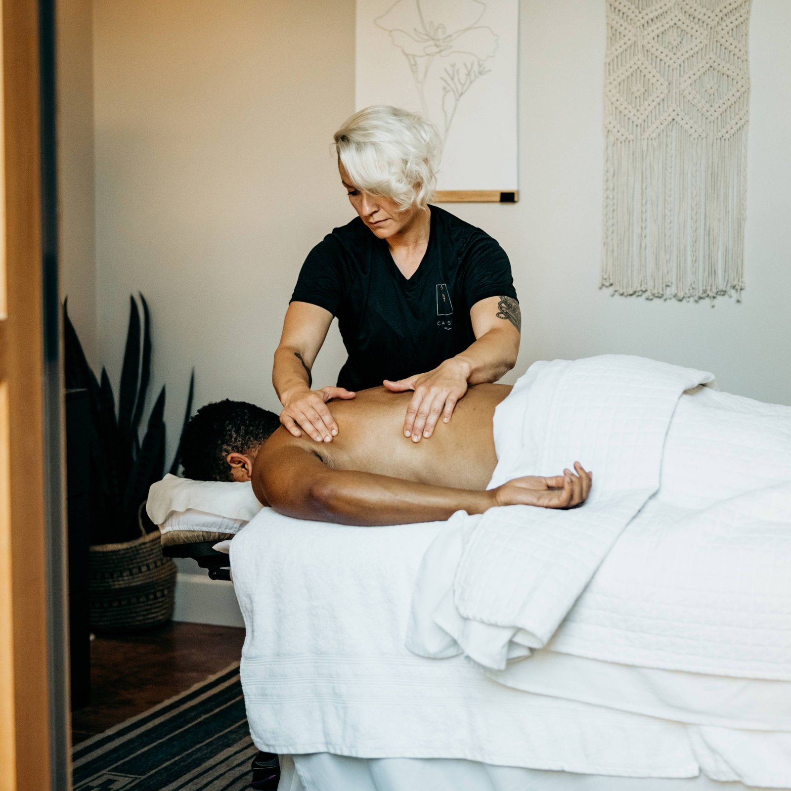 massage therapist giving a massage at Calm Spa